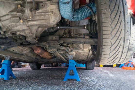 car lifted on jack stands showing correct support points for Jack Stand safety
