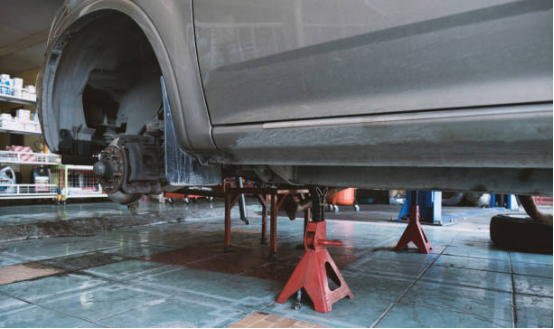 A jack supporting a car