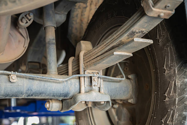 Underside view of truck leaf spring suspension. Always use Jack Stands for safety.