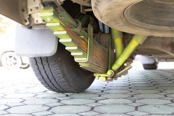 Rear vehicle leaf spring suspension near tire. Secure with Jack Stands before working.